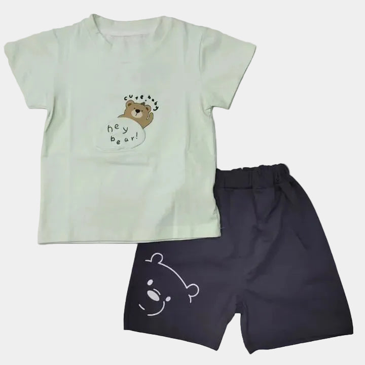 Light green t-shirt and dark shorts with bear designs on a white background