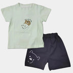 Light green t-shirt and dark shorts with bear designs on a white background