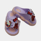 Purple children's sandals with Hello Kitty design on a light gray background