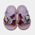Purple children's sandals with Hello Kitty characters on a light gray background