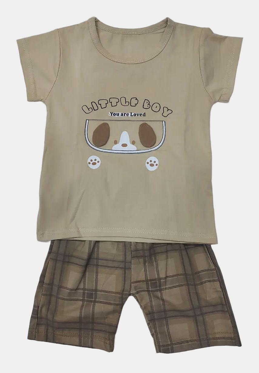 Beige t-shirt with cartoon design and plaid shorts on a light gray background