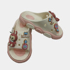 Pair of children's sandals with cartoon character design on a white background