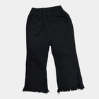 Black pants on a white surface