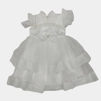 White dress with a bow on a light gray background