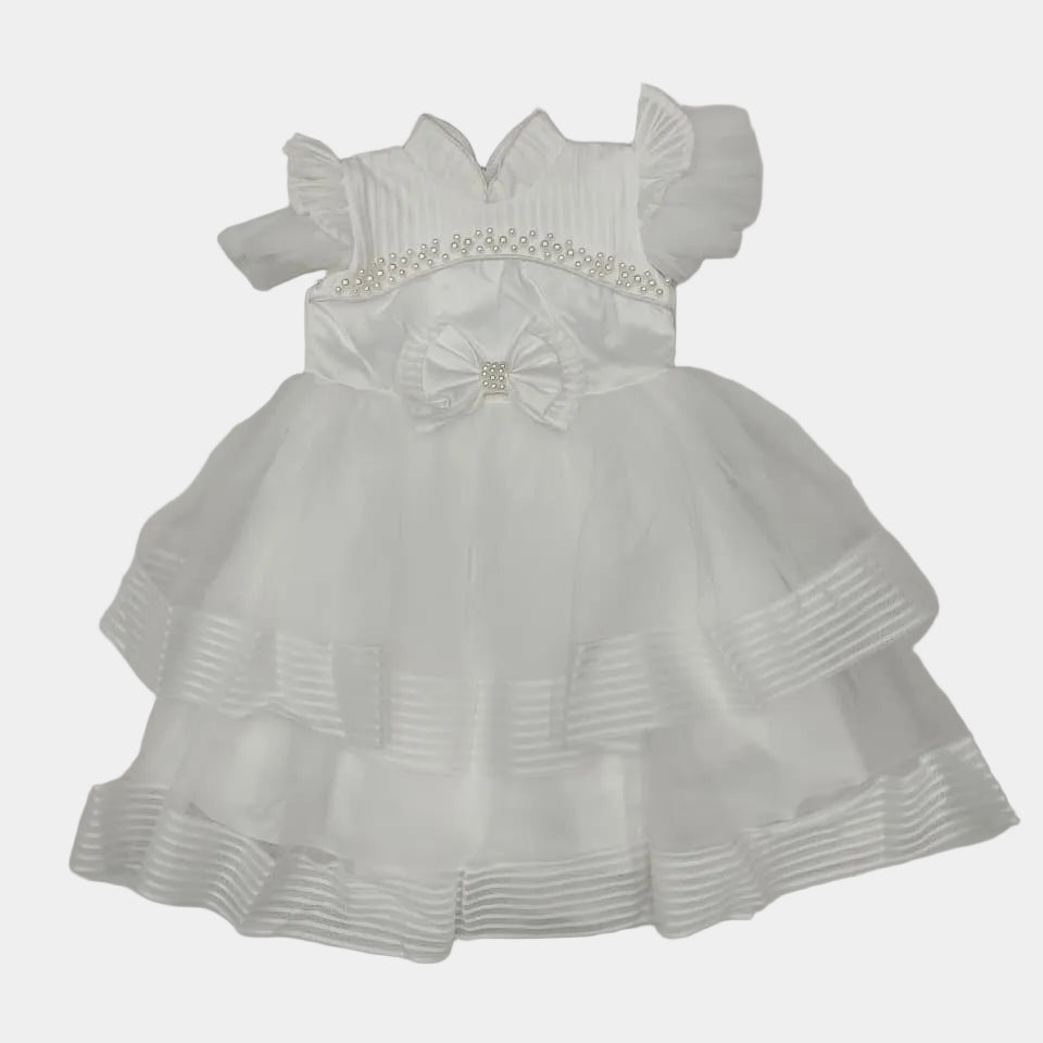 White dress with a bow on a light gray background