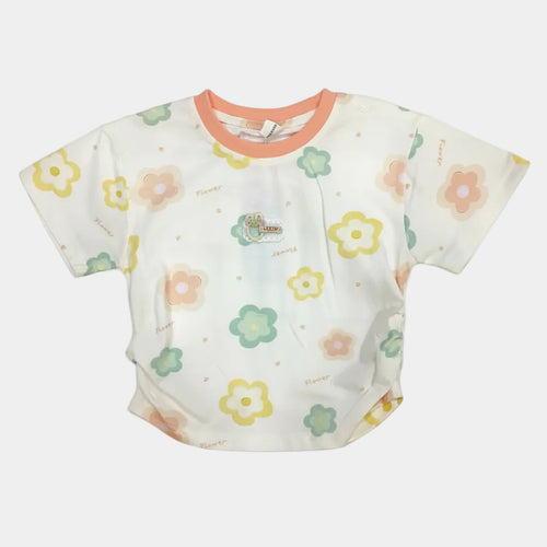 Baby bib with floral pattern on a white background