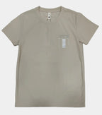 Beige t-shirt with a small logo on a light gray background