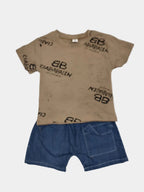 Children's brown t-shirt with branding and blue shorts on a light gray background