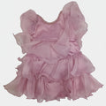 Pink dress with ruffled layers on a white surface