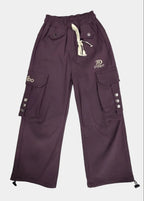 Purple pants with brand logos on a light gray background