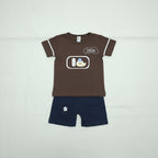 Brown sleeveless shirt with cartoon design and gray shorts on a white background