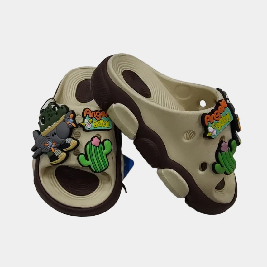 Pair of children's sandals with decorative charms on a light gray background