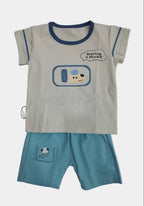 Children's outfit with cartoon design on a plain background