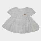 White dress with floral embroidery on a white background