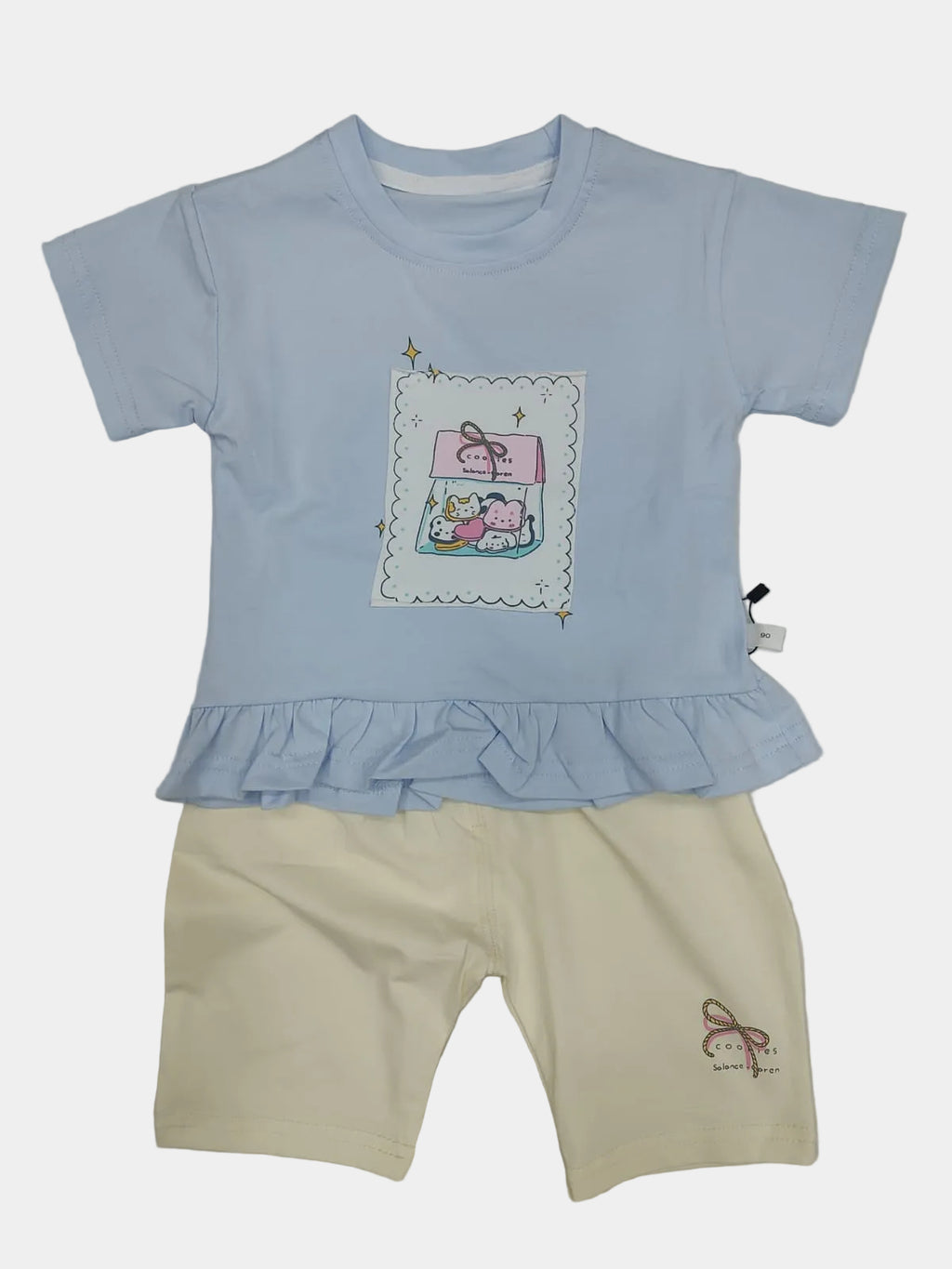 Children's light blue top and beige shorts set on a plain background