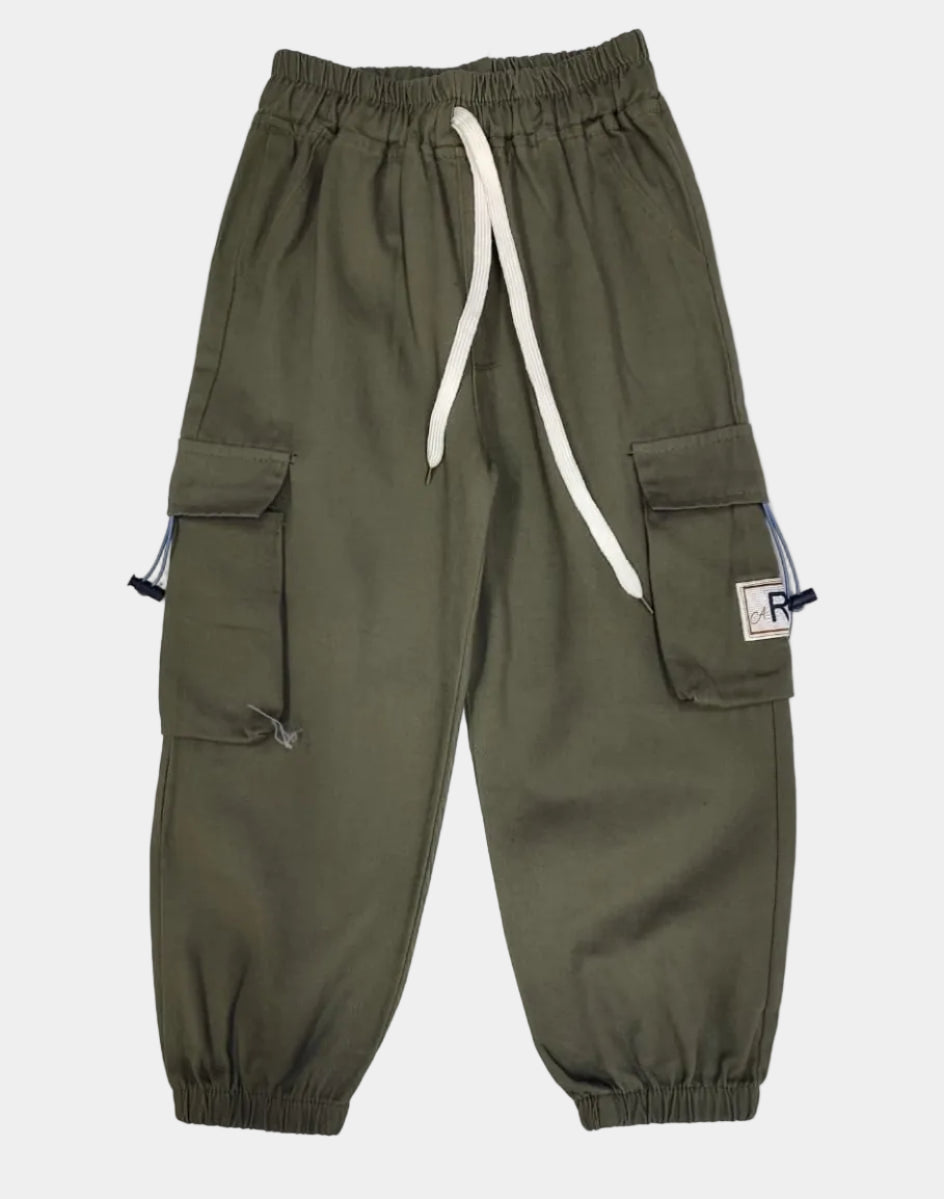 Green pants with white drawstring on a light gray background