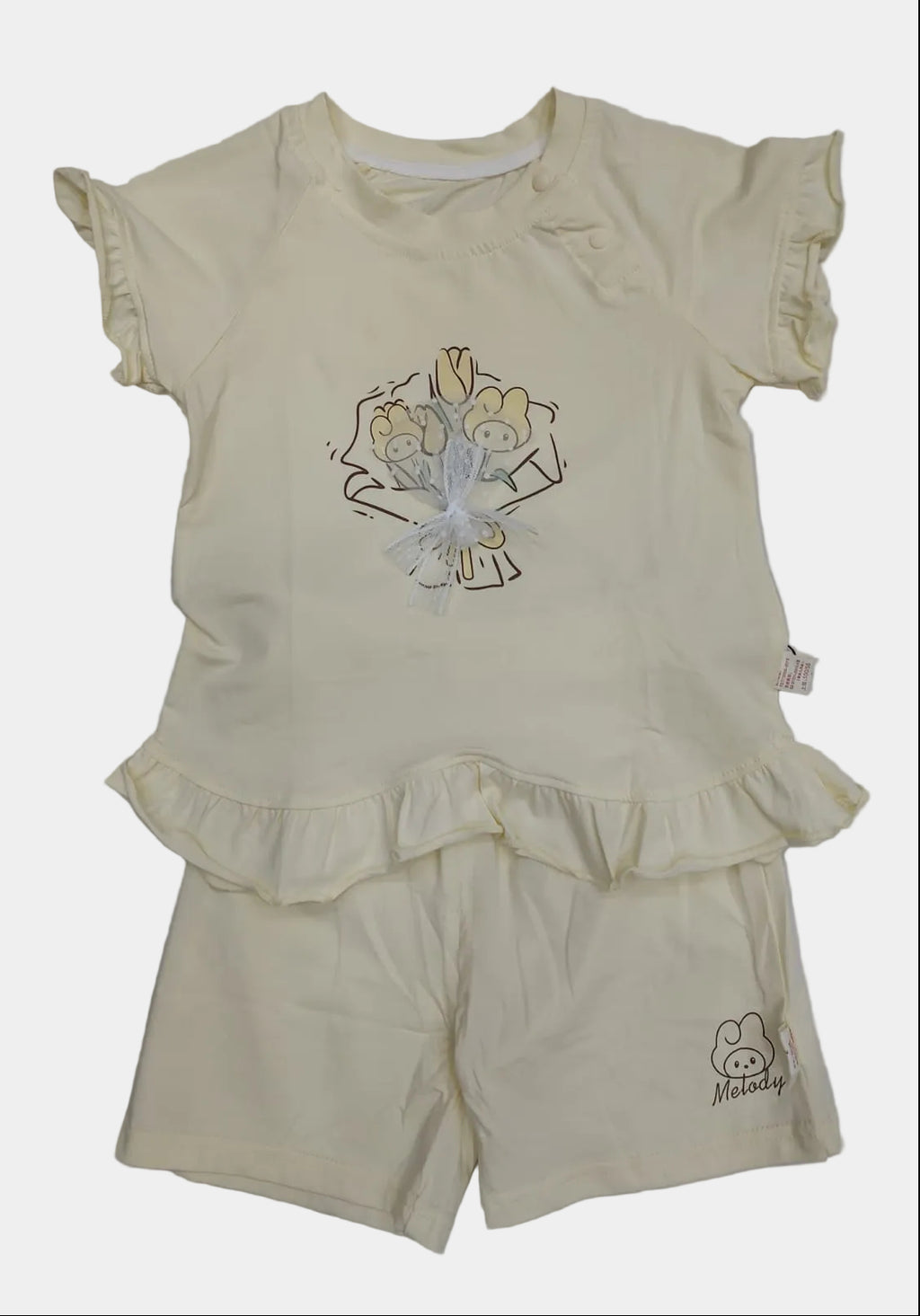 Children's yellow outfit with a top and shorts on a white background
