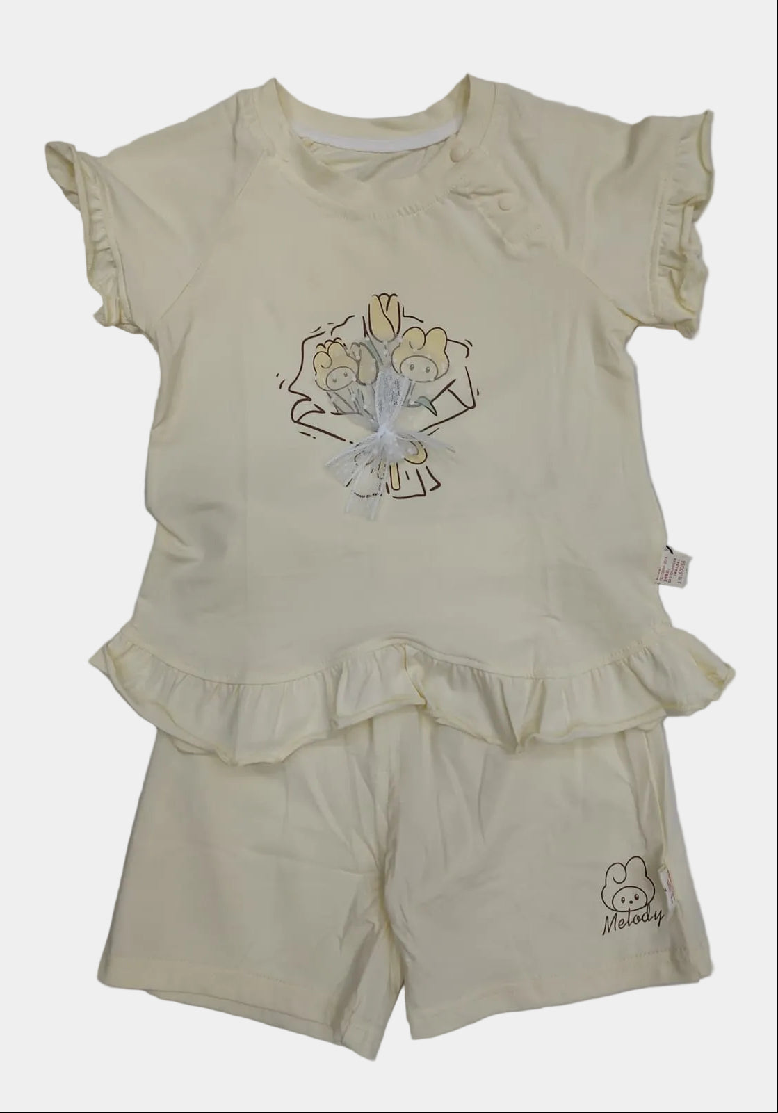 Children's yellow outfit with a top and shorts on a white background