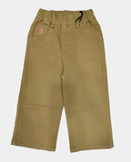 Beige pants with a small pink flower design on a white background