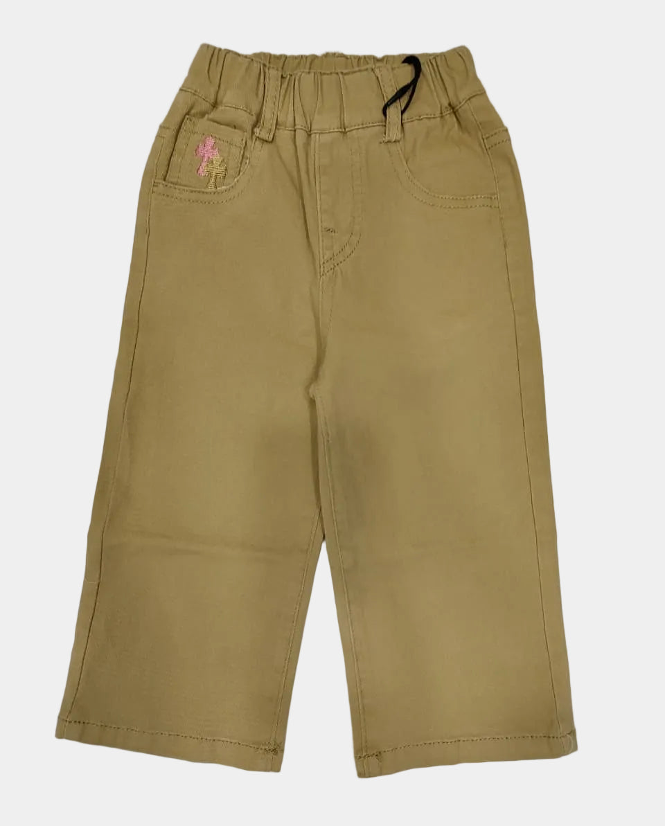 Beige pants with a small pink flower design on a white background