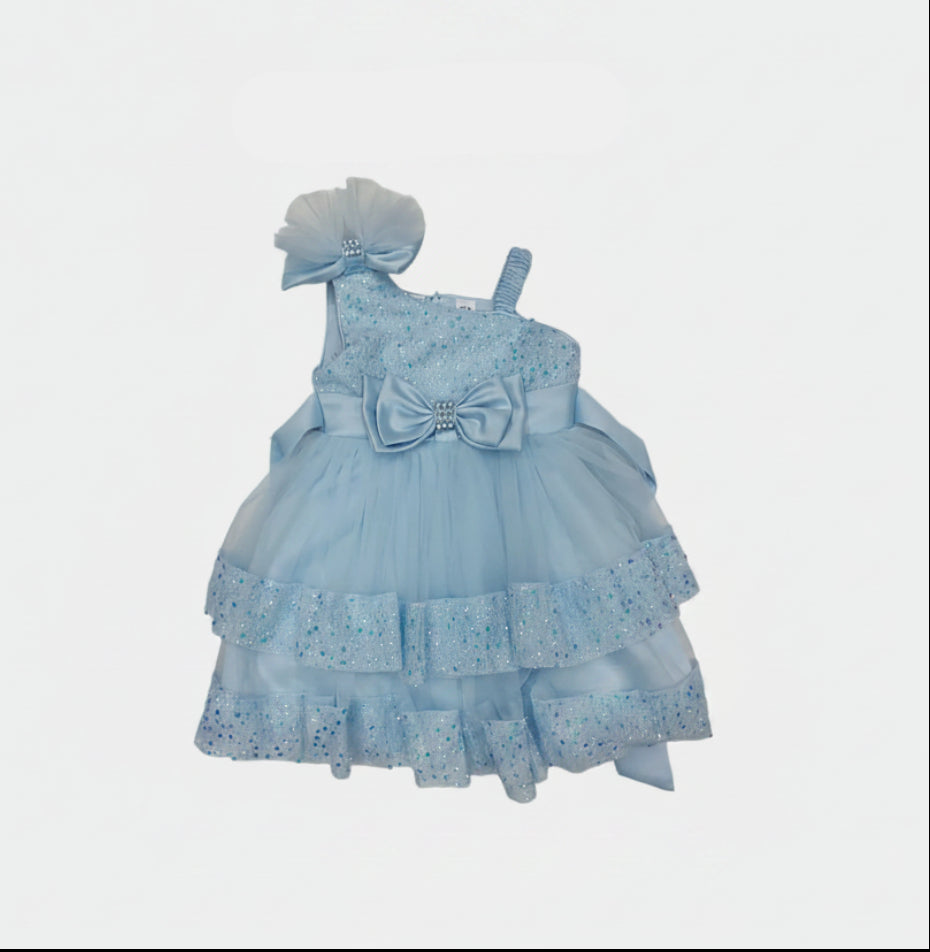 Light blue dress with a bow and matching headband on a light gray background