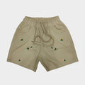 Beige shorts with floral embroidery on a white background