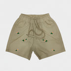 Beige shorts with floral embroidery on a white background