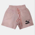 Pink shorts with Puma logo on a light gray background