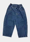 Blue jeans on a white surface