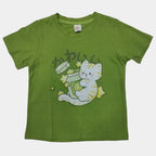 Green t-shirt with cartoon design on a white surface