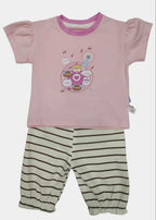 Pink top with cartoon design and striped pants on a white background