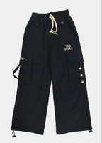 Black cargo pants with buttons and drawstring on a light gray background