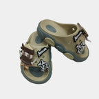 Pair of children's sandals with cartoon character design on a white background