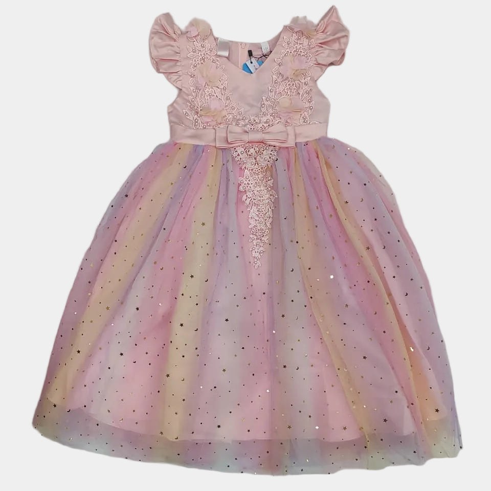 Colorful children's dress on a white sheet with a tiled floor background