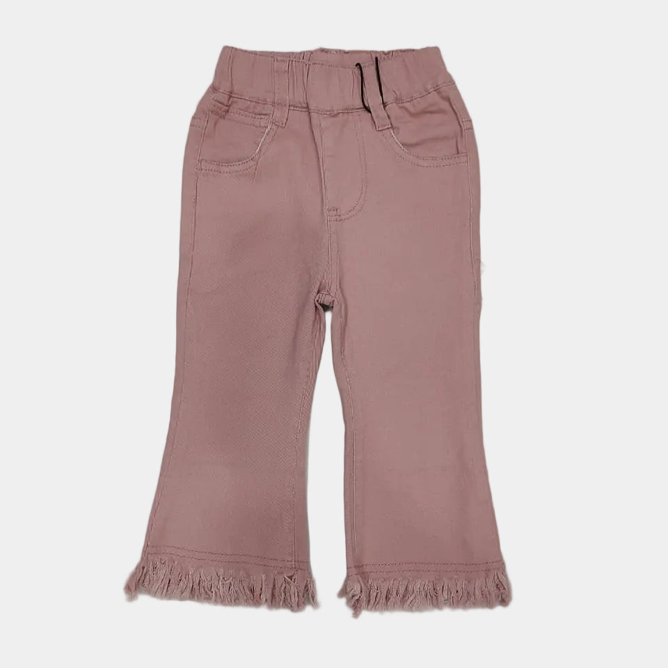 Pink pants with frayed hem on a white background