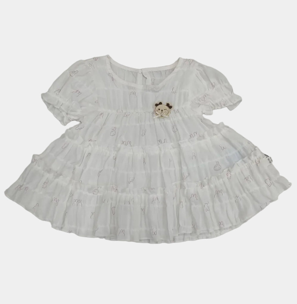 White lace dress on a tiled floor