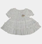 White lace dress on a tiled floor