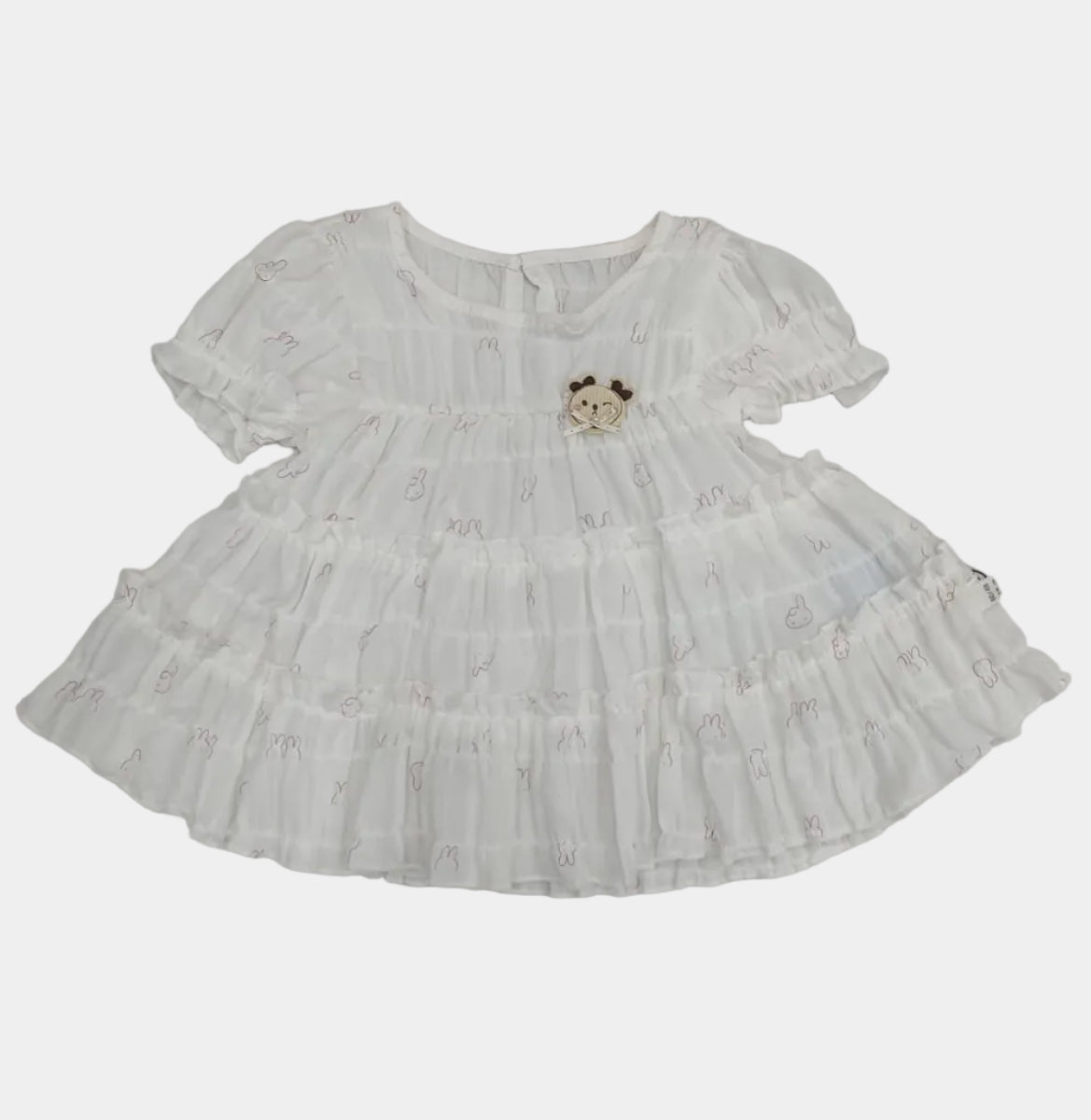 White lace dress on a tiled floor