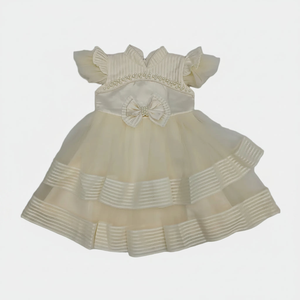 Cream-colored dress with a bow on a white background
