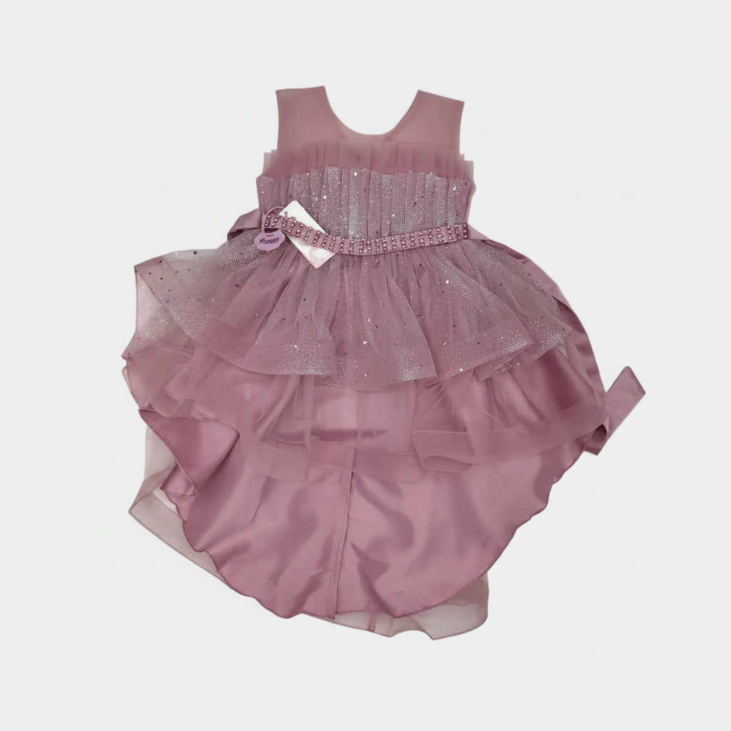 Pink dress with a sheer overlay on a light gray background