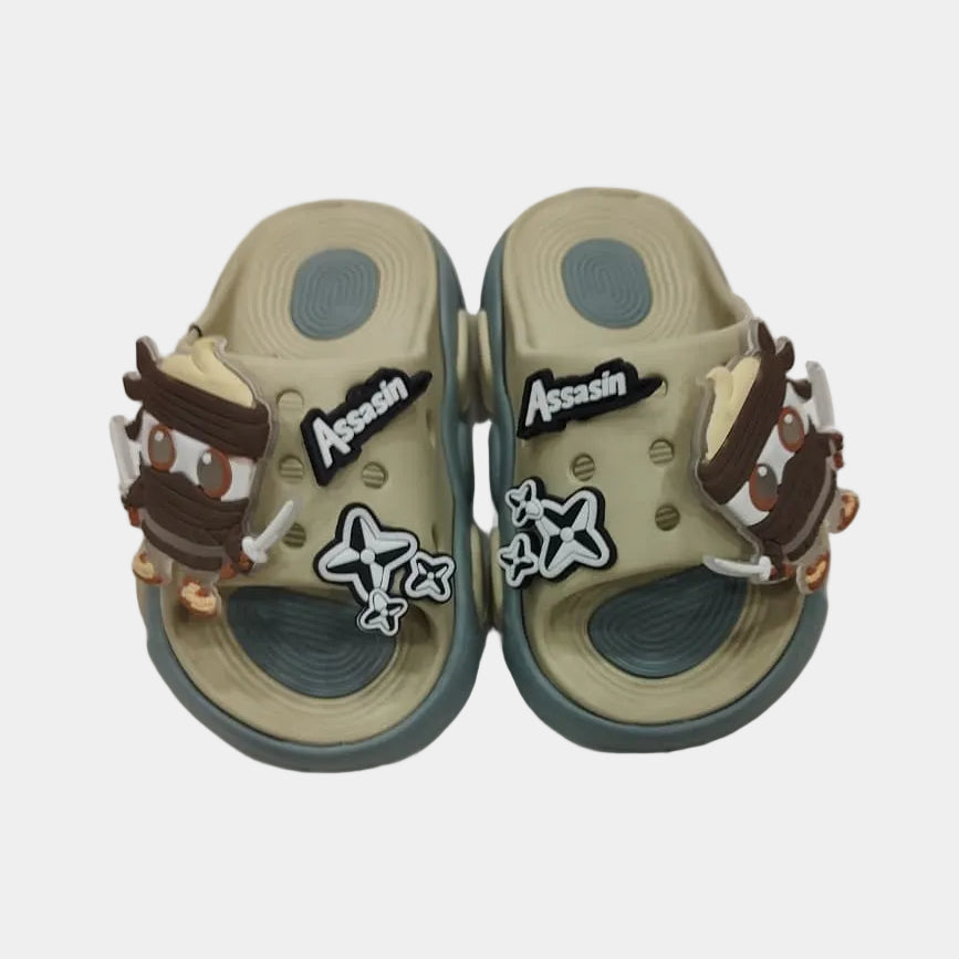 Pair of beige sandals with decorative elements on a light gray background