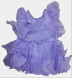 Purple dress with ruffles on a white surface
