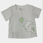 White t-shirt with a cartoon bunny design on a plain background