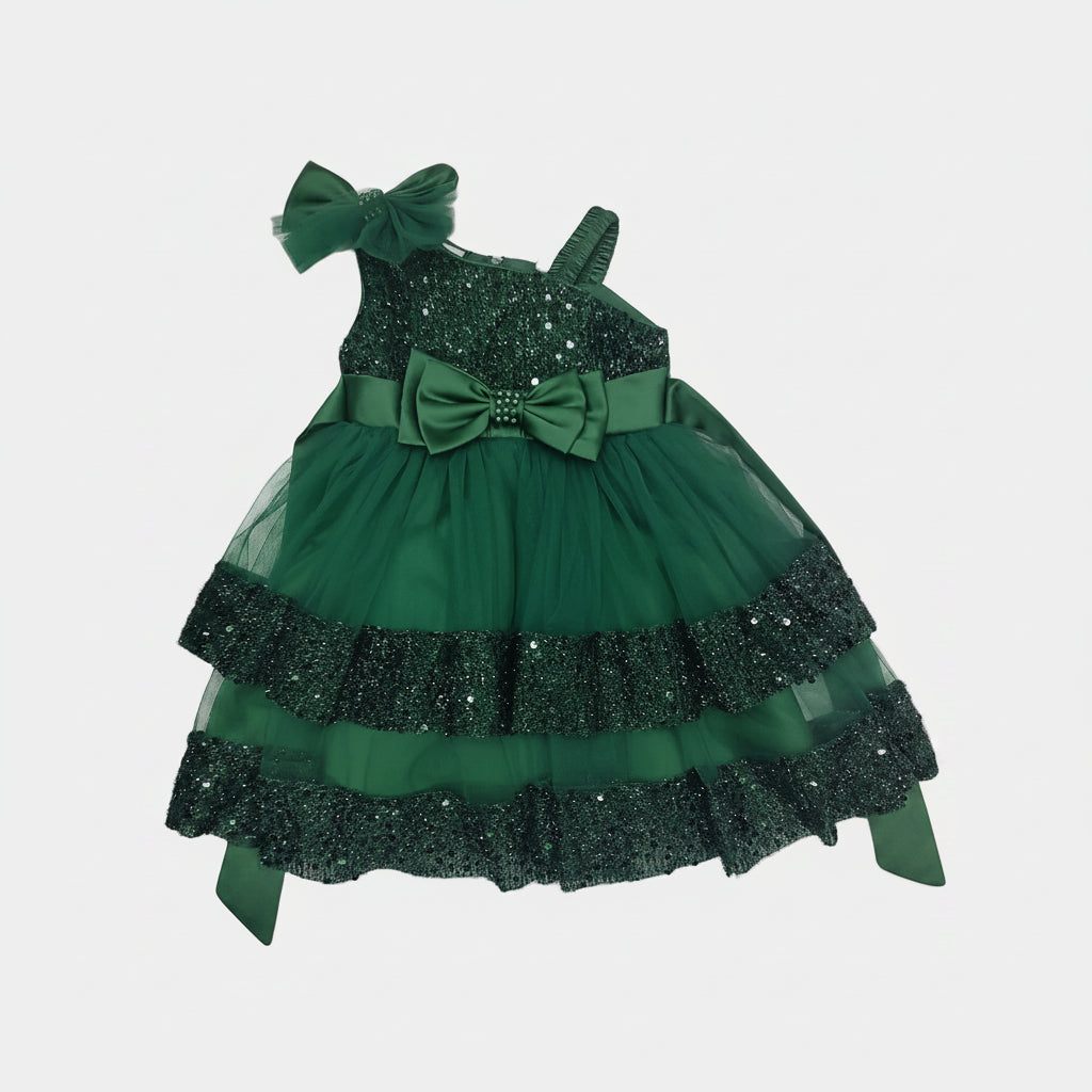 Green dress with decorative elements on a white background