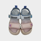 Pair of children's sandals with pink and blue straps on a light gray background