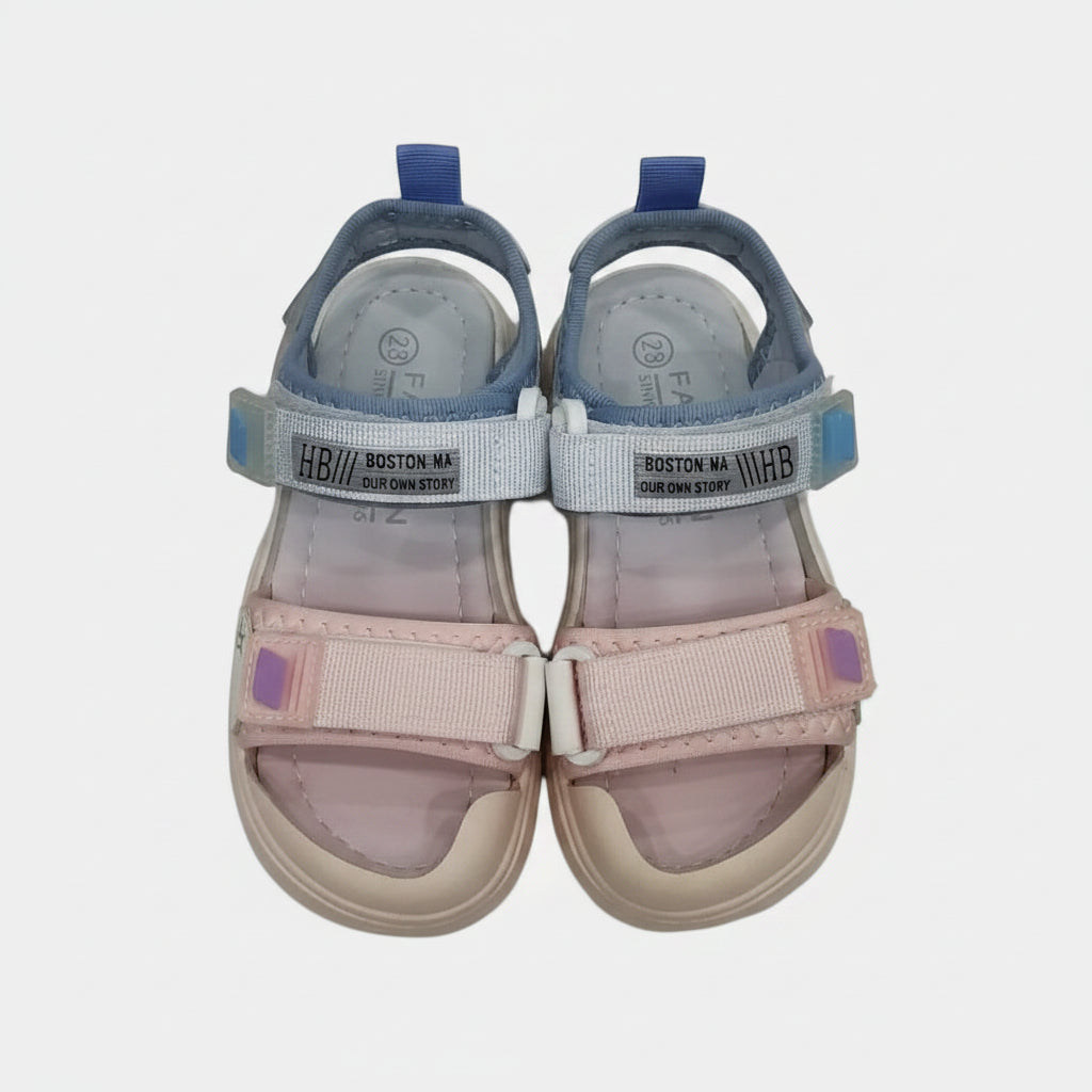 Pair of children's sandals with pink and blue straps on a light gray background