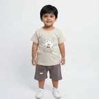 Children's outfit with t-shirt and shorts featuring bear designs on a light gray background
