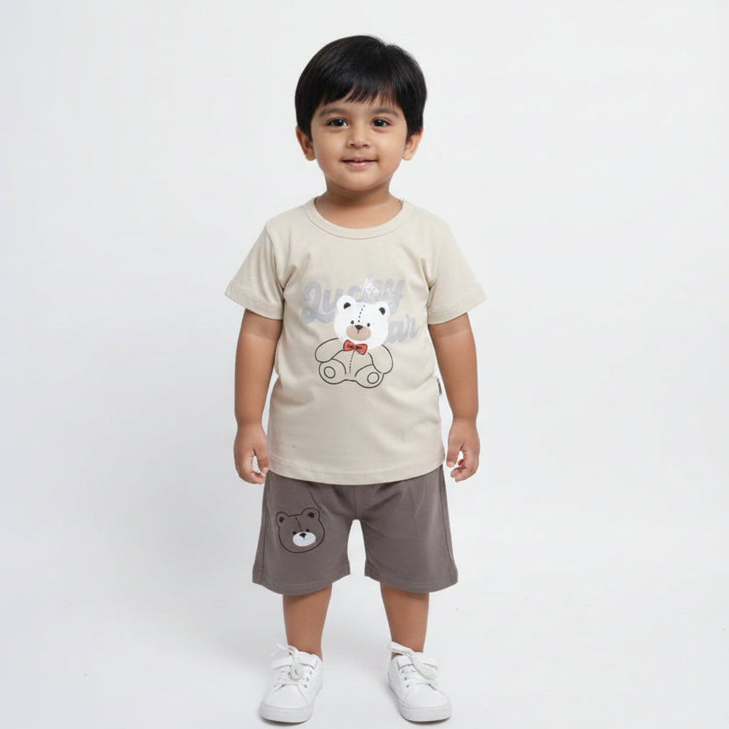 Children's outfit with t-shirt and shorts featuring bear designs on a light gray background