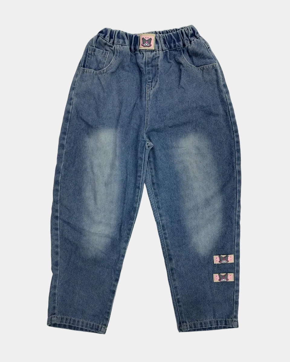 Pair of blue jeans with visible distressing on a light gray background