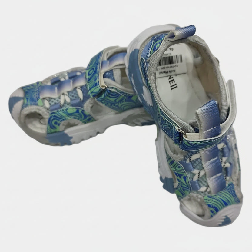 Pair of children's sandals with blue and green pattern on a white background